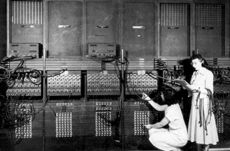 Two women working on a telephone switchboard.